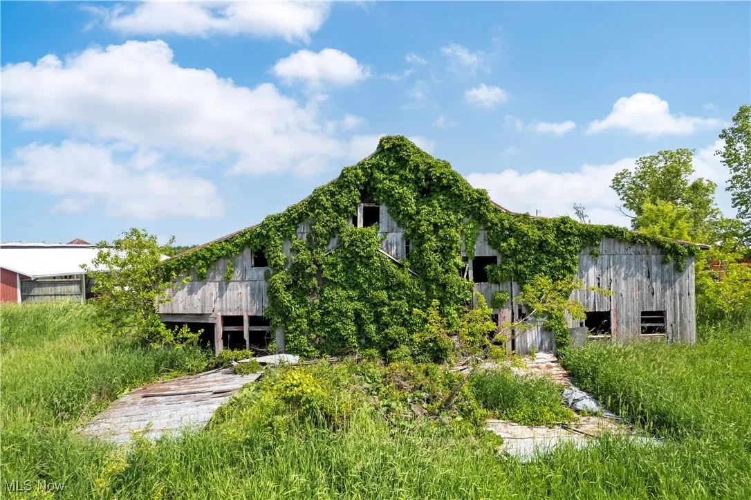 Back of property featuring an outbuilding