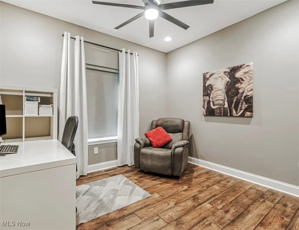 Home office featuring ceiling fan, wood finished floors, recessed lighting, and baseboards