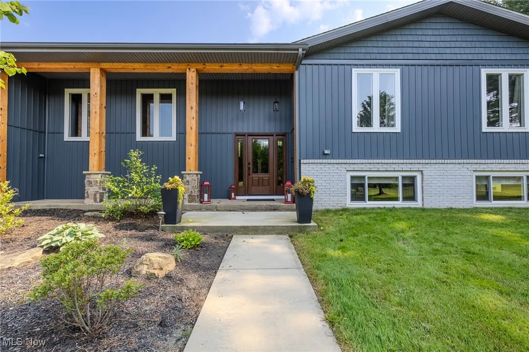 View of front of home  and covered porch