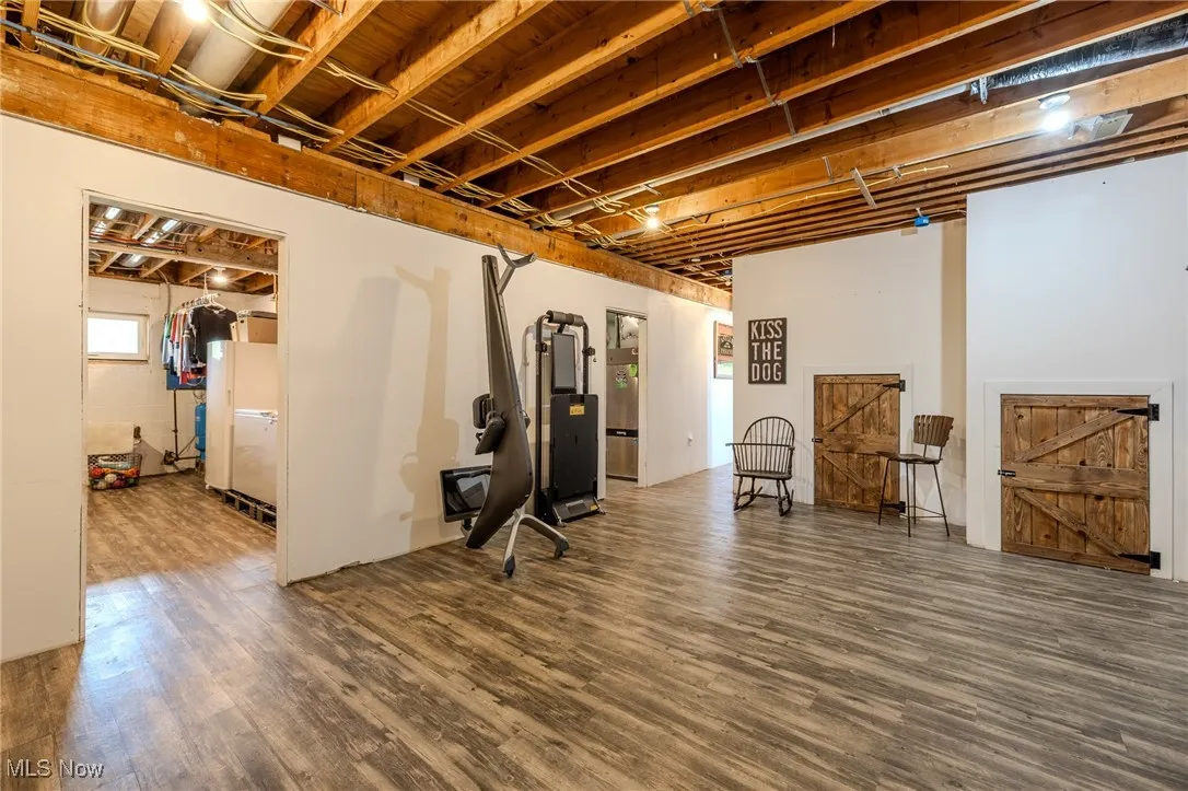 Below grade area featuring wood finished floors