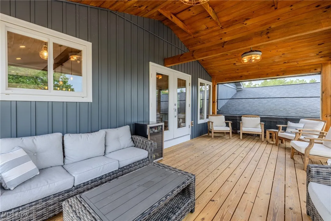 Deck featuring an outdoor hangout area and french doors