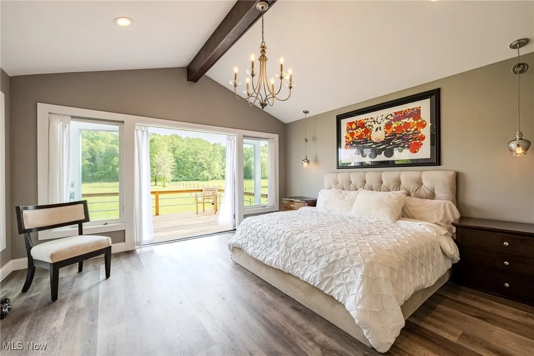 Bedroom with access to outside, a chandelier, wood finished floors, and recessed lighting