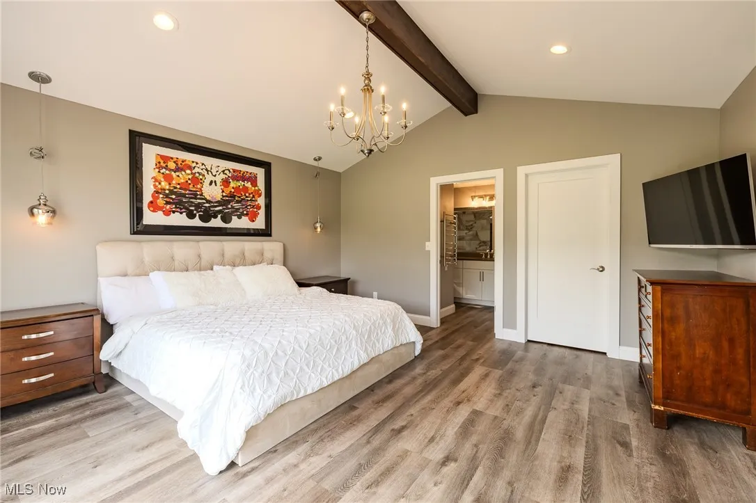 Main Bedroom with a chandelier, wood finished floors, recessed lighting, baseboards, and ensuite bathroom