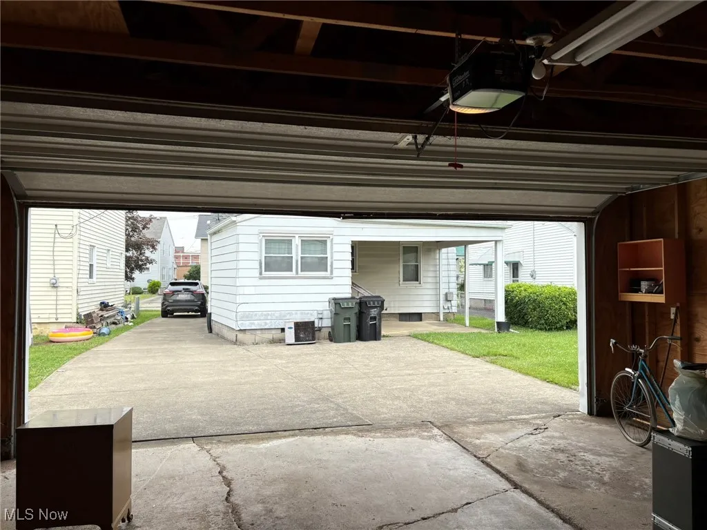 Garage featuring a garage door opener