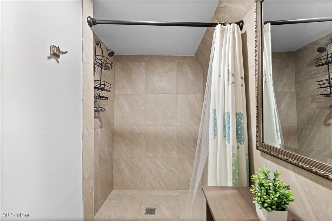 Bathroom with a tile shower