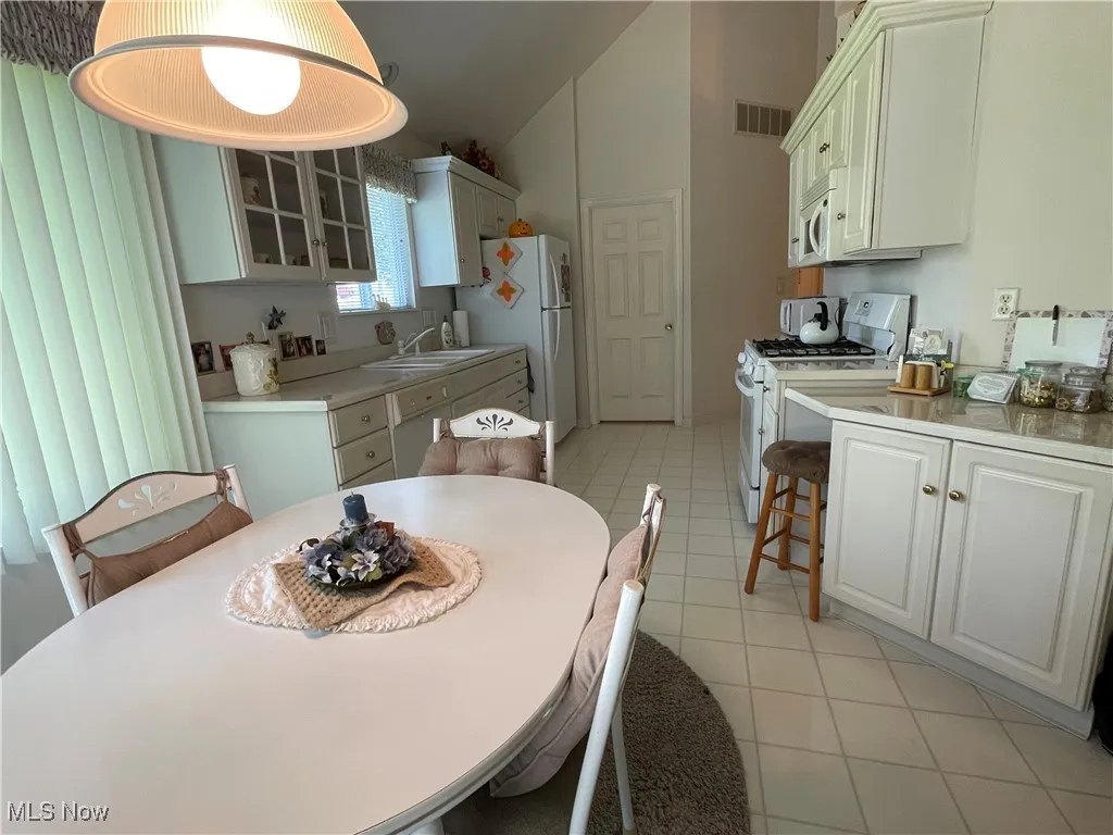 The dining area in the kitchen is bright and cheery with a sliding door to your patio.