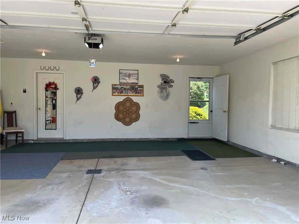 Garage is 26' x 20.4' and has an almost brand new garage door opener.