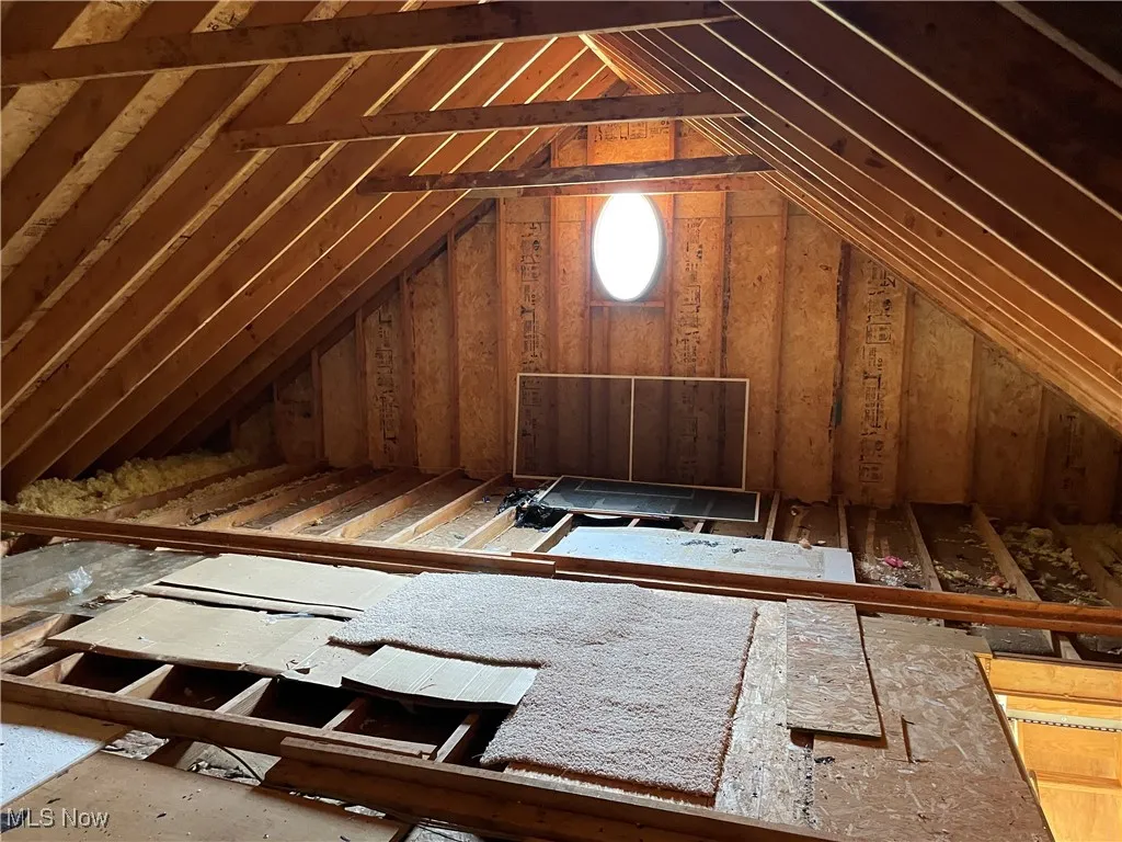 The attic has flooring for seasonal storage.