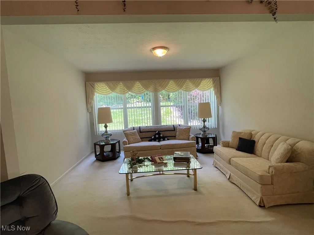 Family room or formal dining room overlooks the back yard and outdoor picnic area.