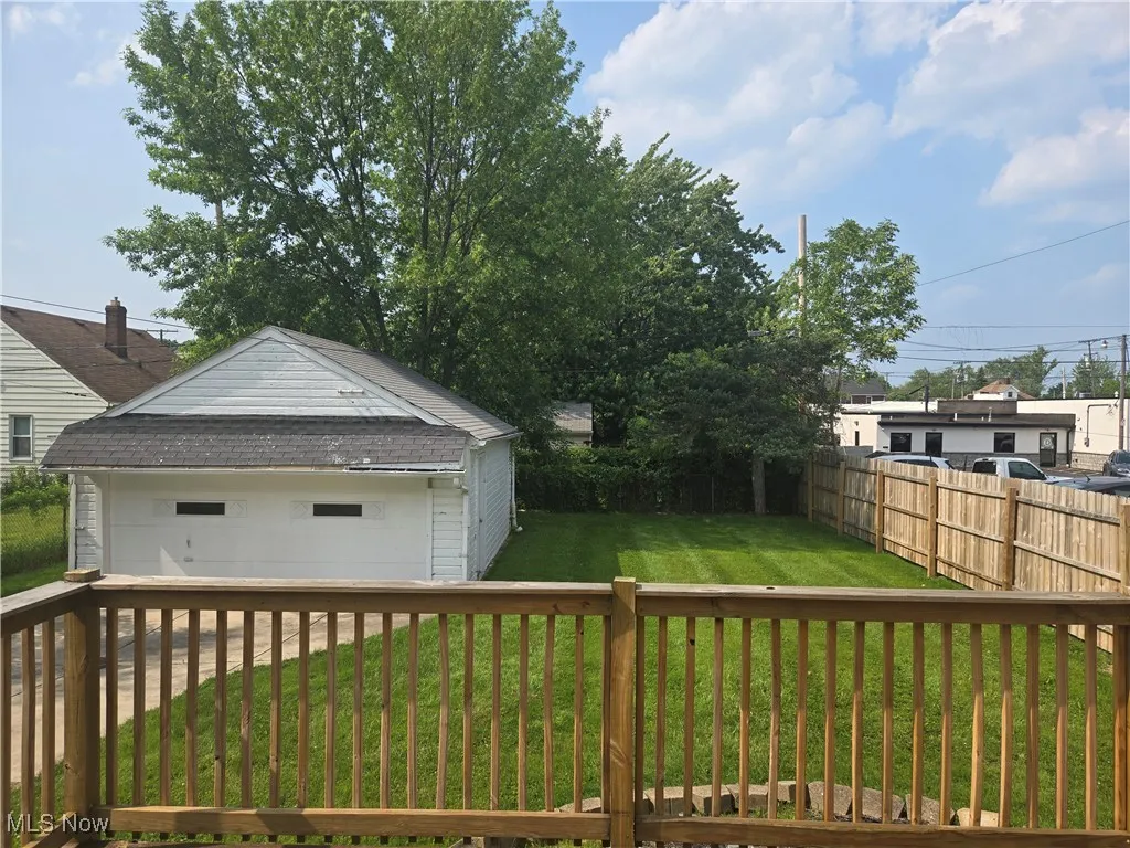 View of yard with an outbuilding and a wooden deck