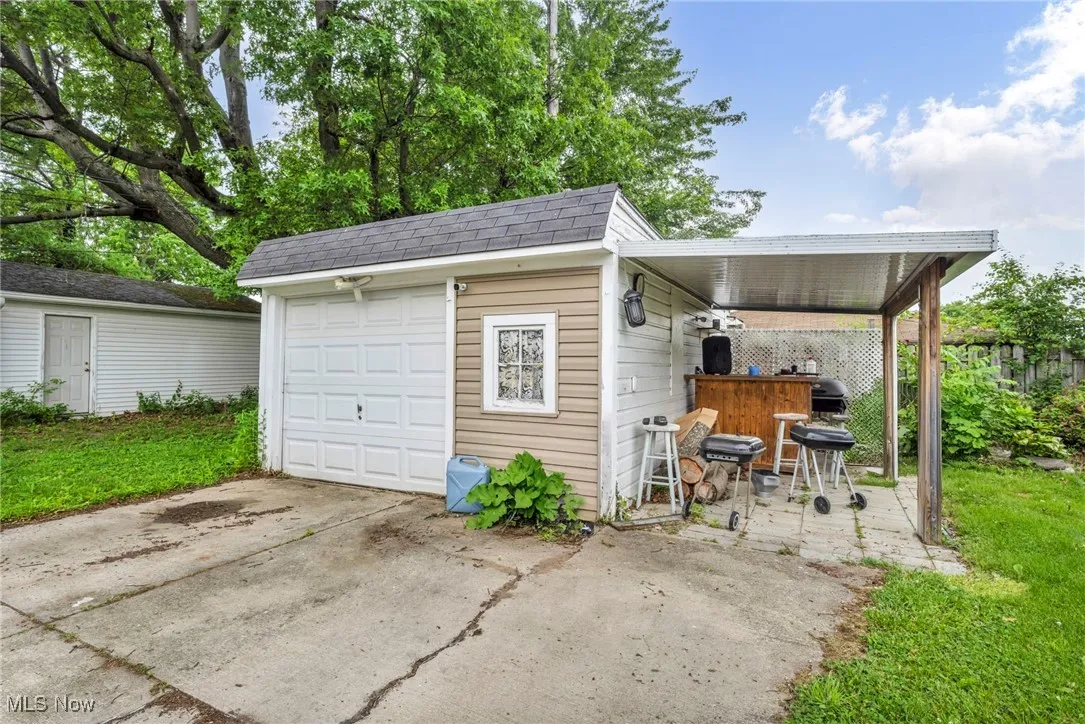 Detached garage featuring driveway