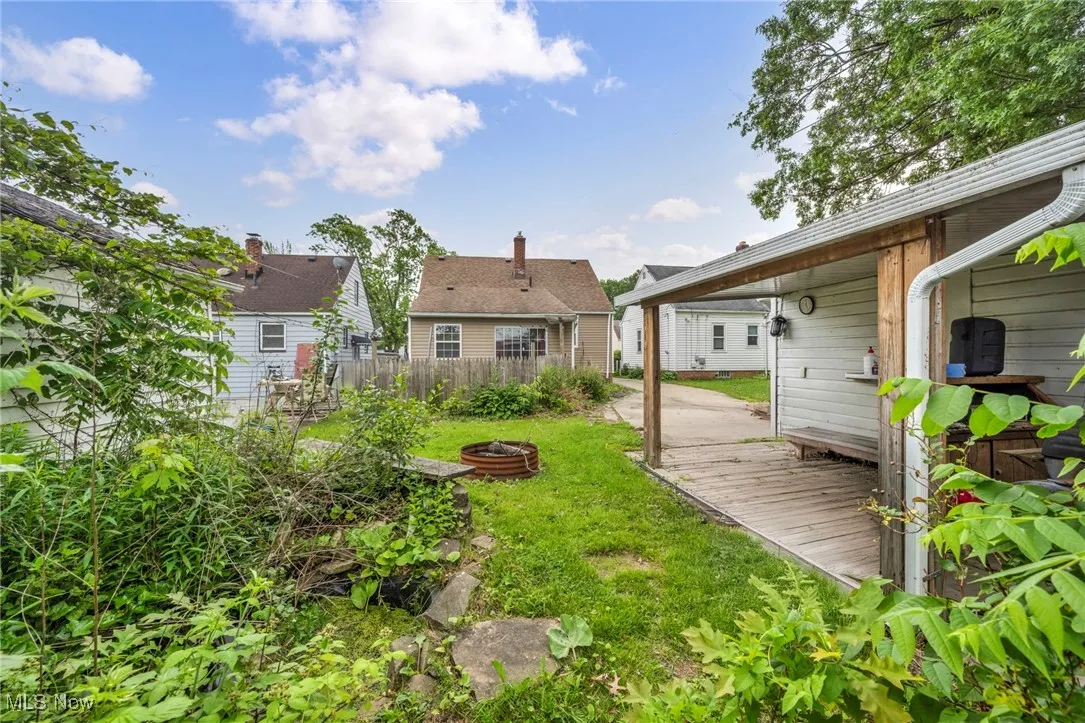View of yard featuring a fire pit and a wooden deck