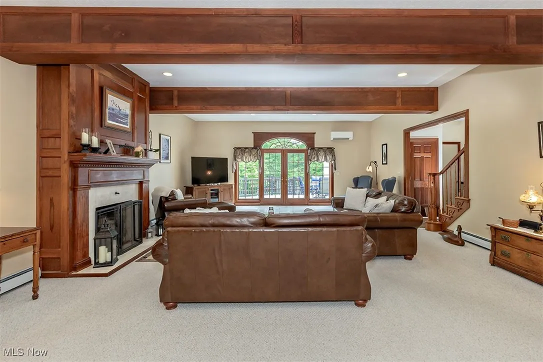 Palladian window crowns a set of French doors which lead to your deck and 3+ acre setting.