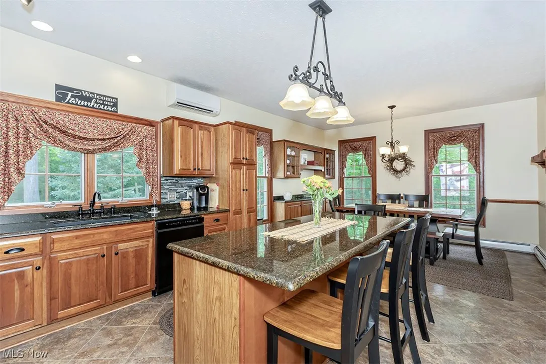 Lots of windows in the Kitchen allow natural light while taking advantage of beautiful private wooded views.