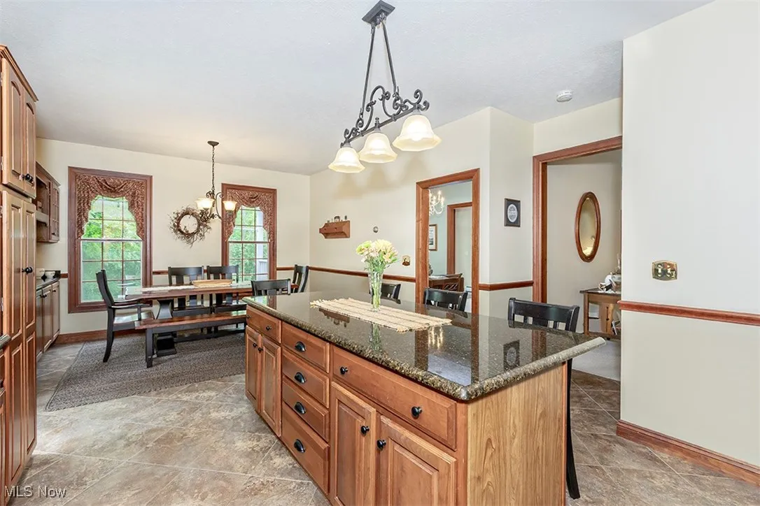 Another view of the Kitchen. The 2 doors on the right lead to the Great Room and Formal Dining Room, respectively.