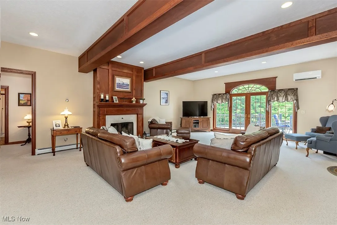 Cherrywood wrapped beams and cherrywood fireplace surround reflect the high-quality interior finishes.