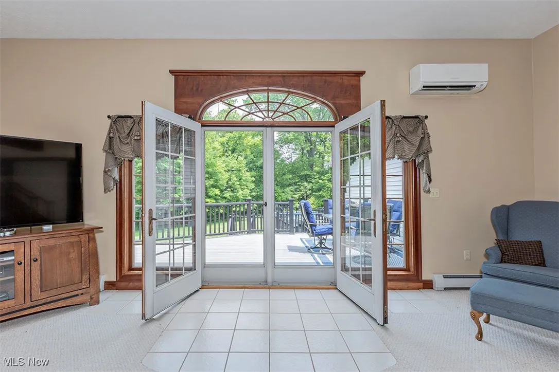 Double French doors lead to the trex two-level Deck.