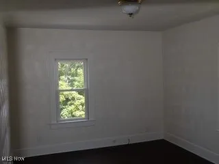 Unfurnished room with healthy amount of natural light