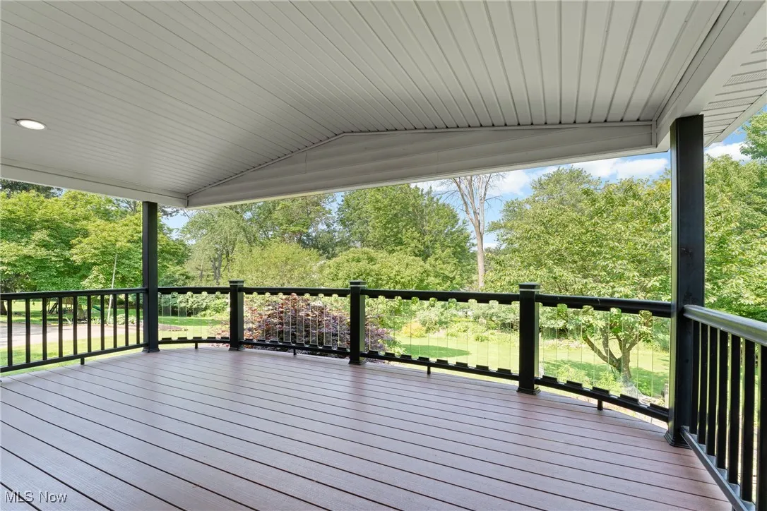 Deck with view of scattered trees