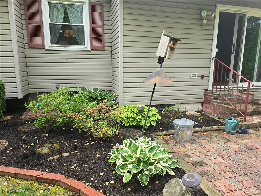 Rear yard with beautiful flower beds.