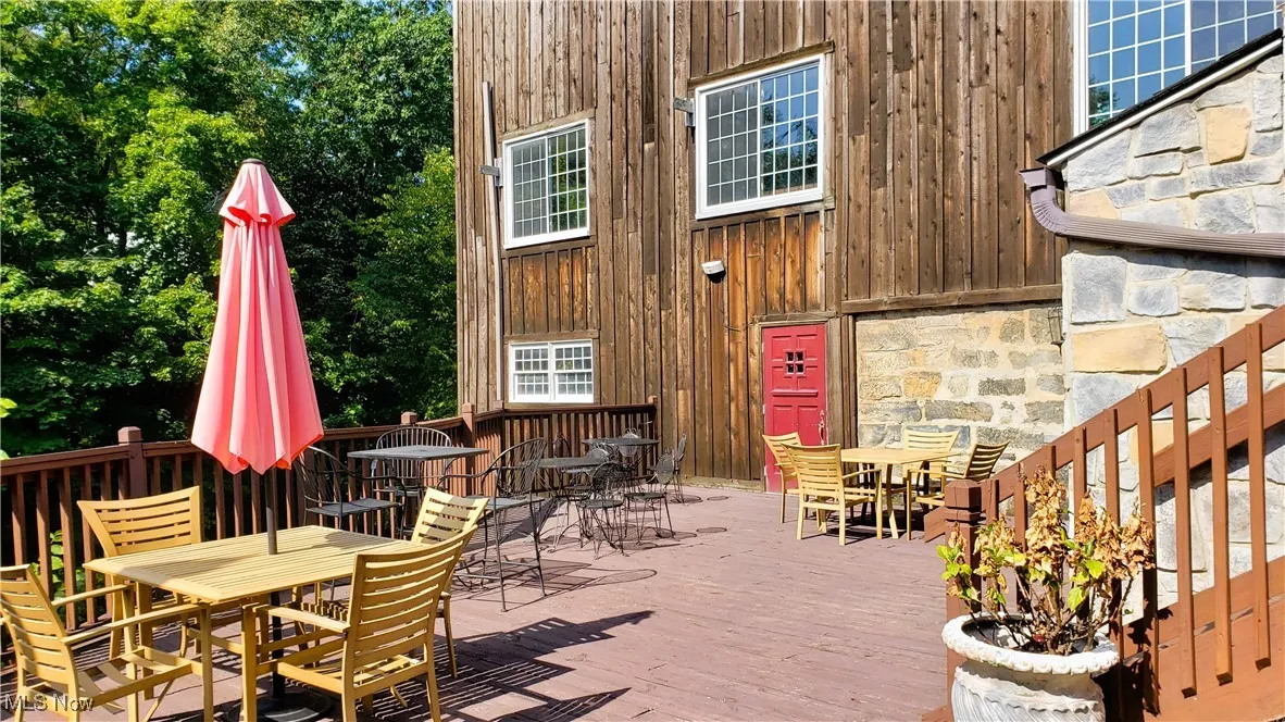 View of patio / terrace with outdoor dining area and a deck