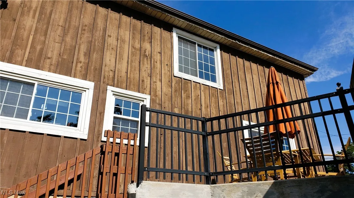 View of home's exterior with stairs