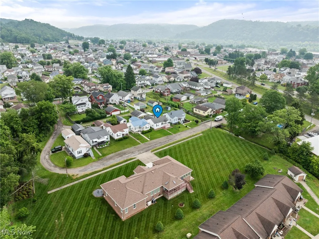 Aerial view of residential area featuring a mountain backdrop