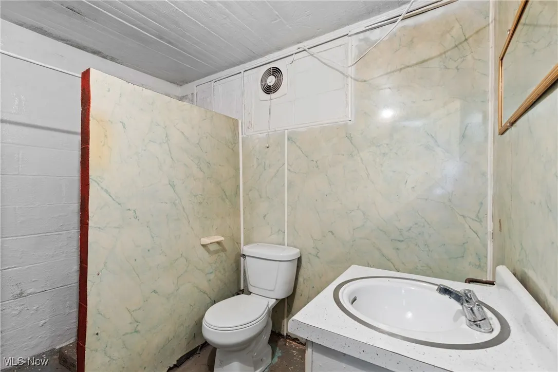 Bathroom with toilet and vanity
