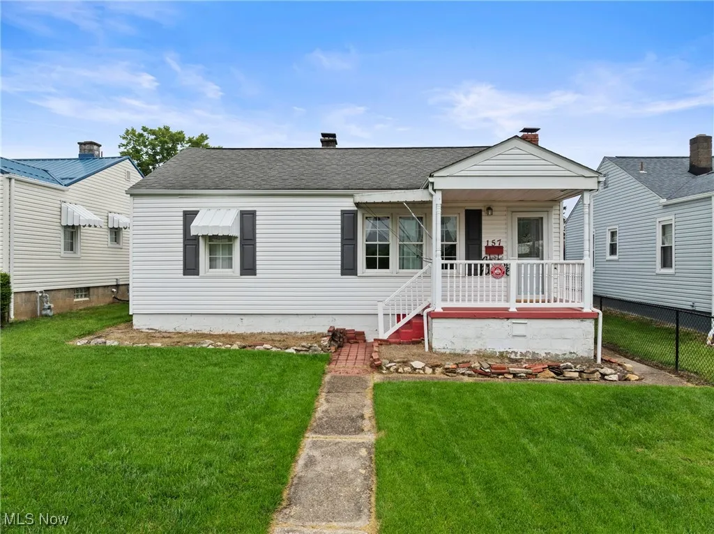 Bungalow-style house with a porch and roof with shingles