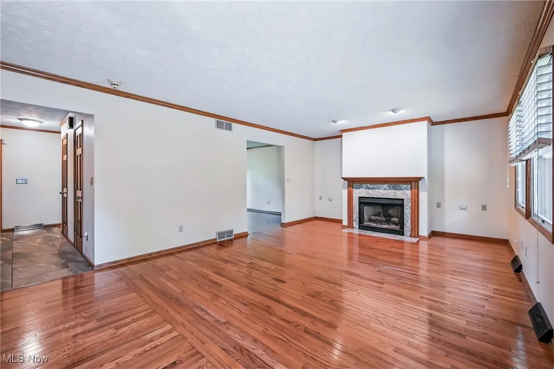 Family room with hardwood floors and gas fireplace