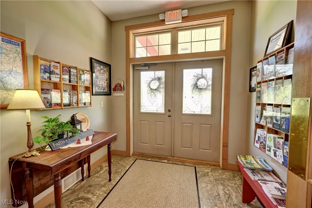 Entrance foyer featuring baseboards