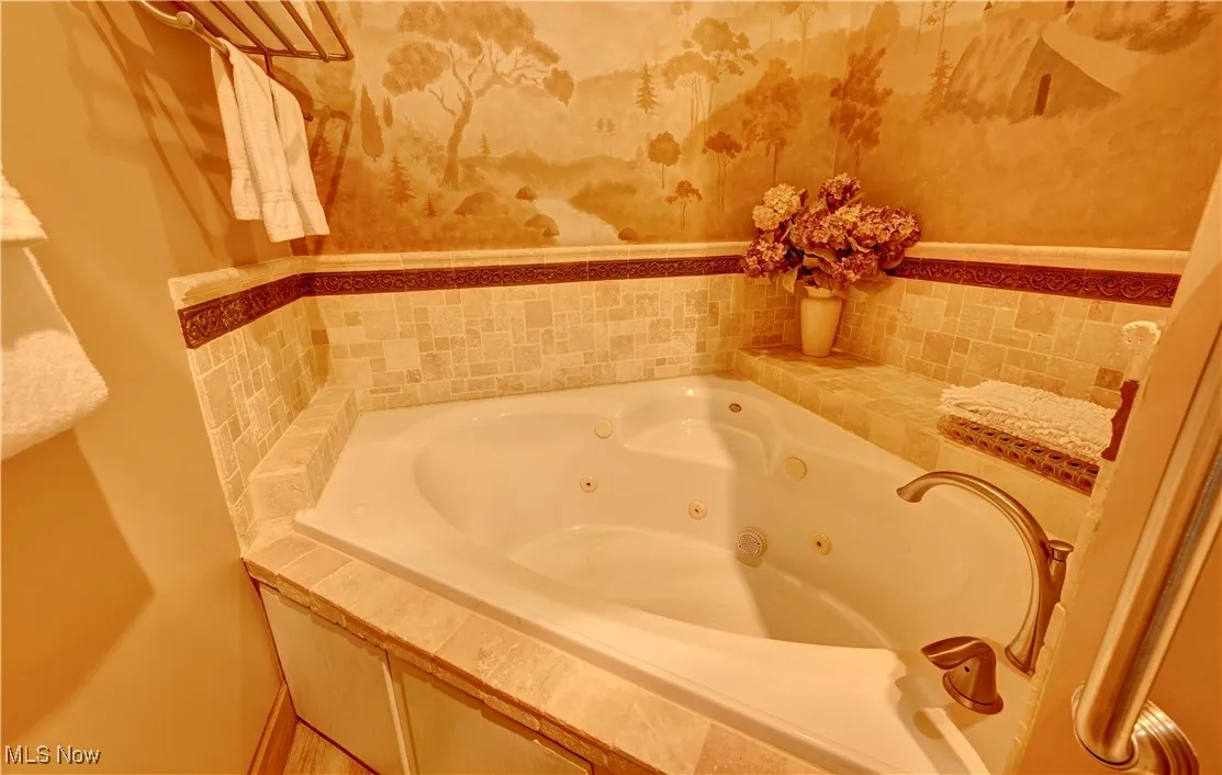 Bathroom featuring a tub with jets