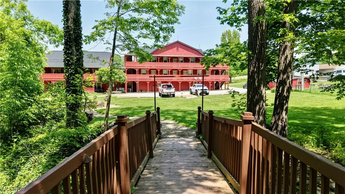 View of property's community with a yard