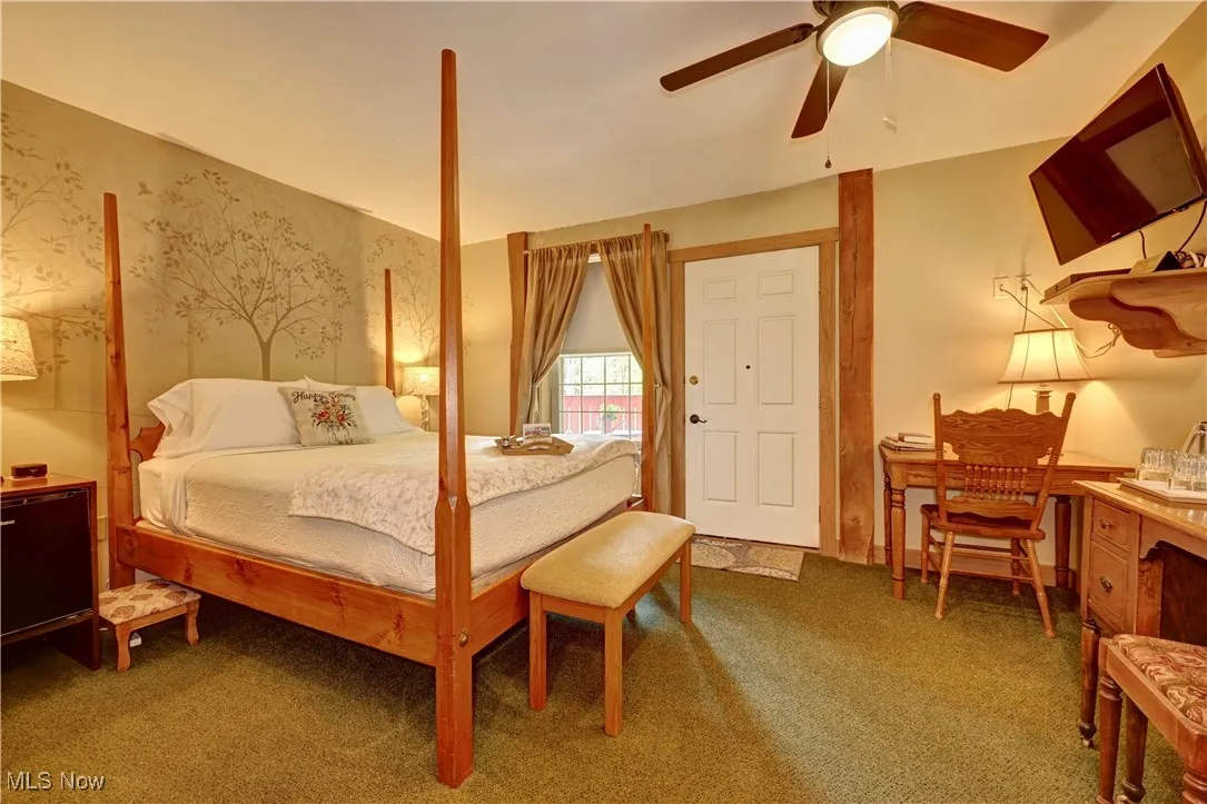 Bedroom featuring carpet and ceiling fan