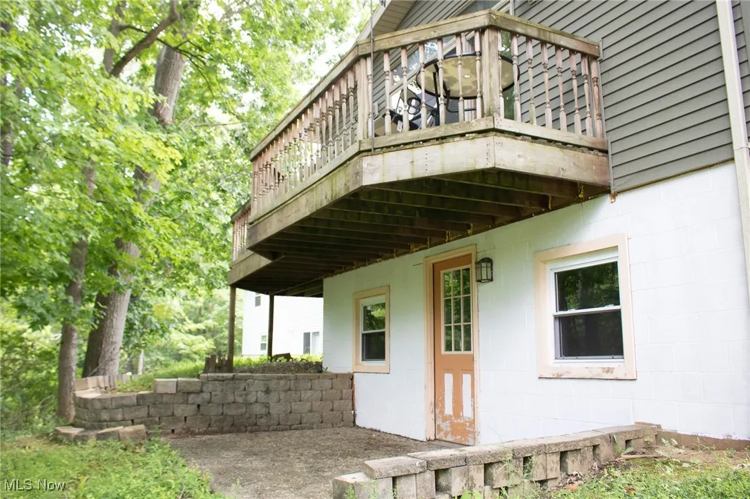 View of side of home with concrete block siding
