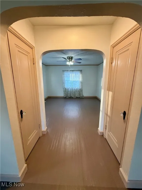 Corridor featuring hardwood / wood-style flooring