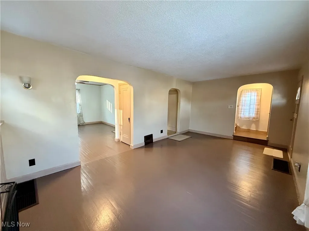Empty room with a textured ceiling