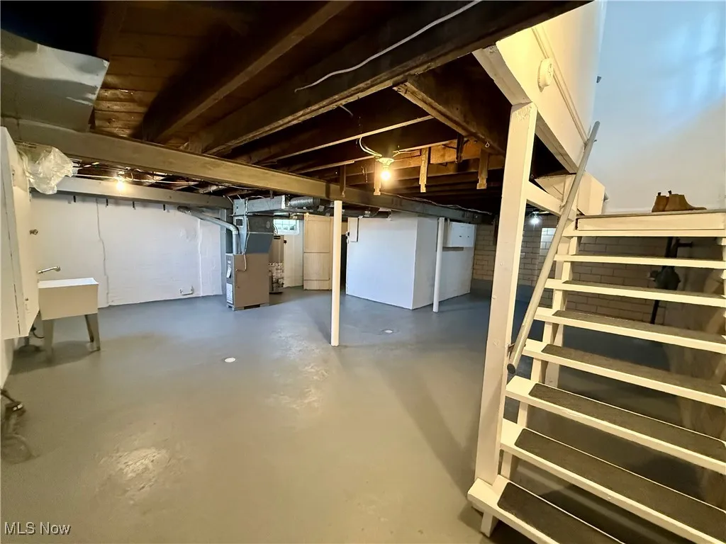 Basement with heating unit and sink