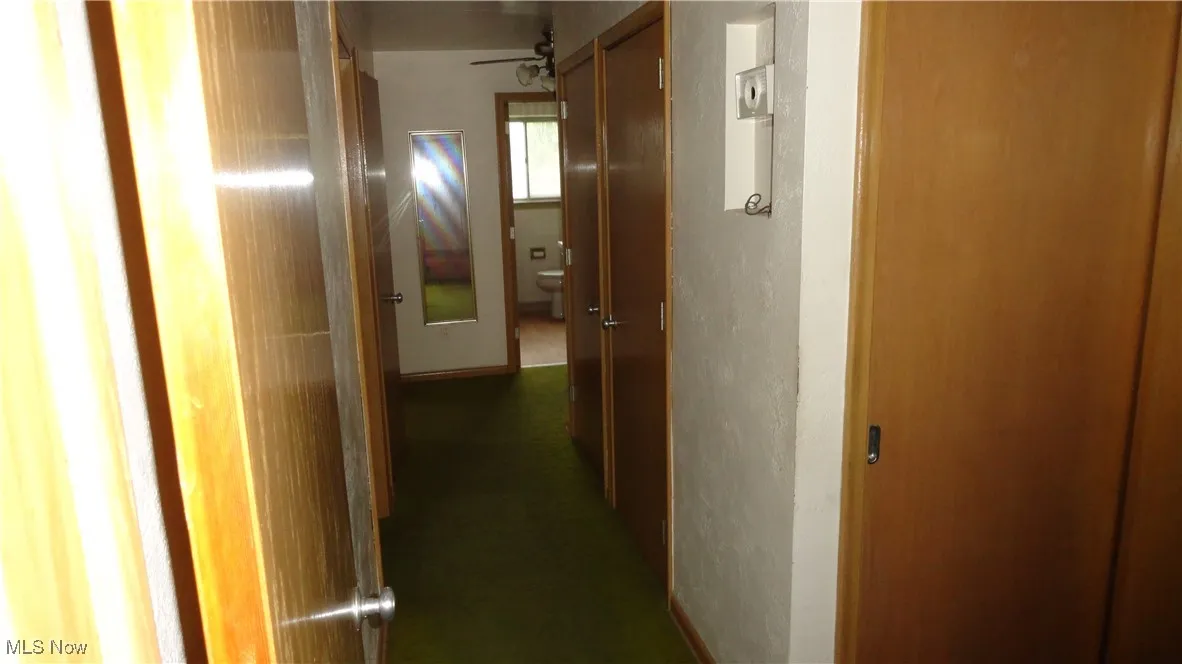 Hallway with 3 closets