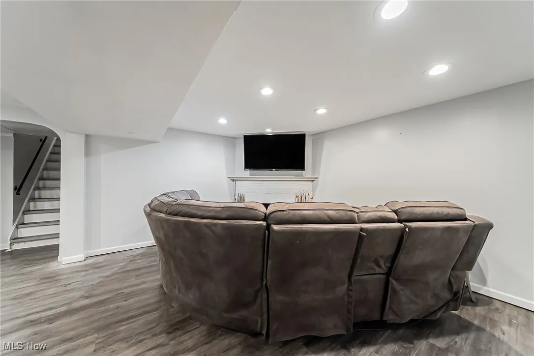 Home theater room featuring wood finished floors and recessed lighting