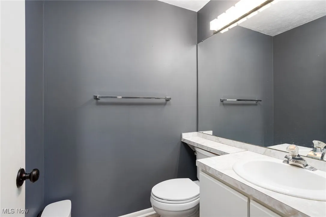 Half bath with toilet and vanity
