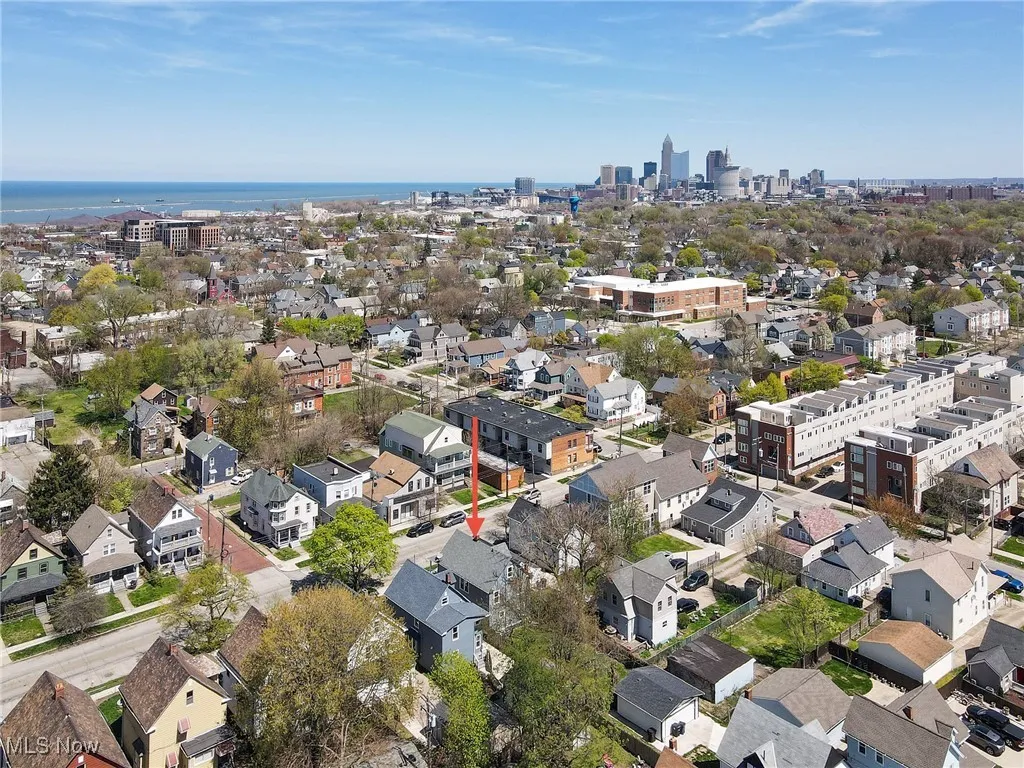 Aerial view of property's location featuring nearby urban area