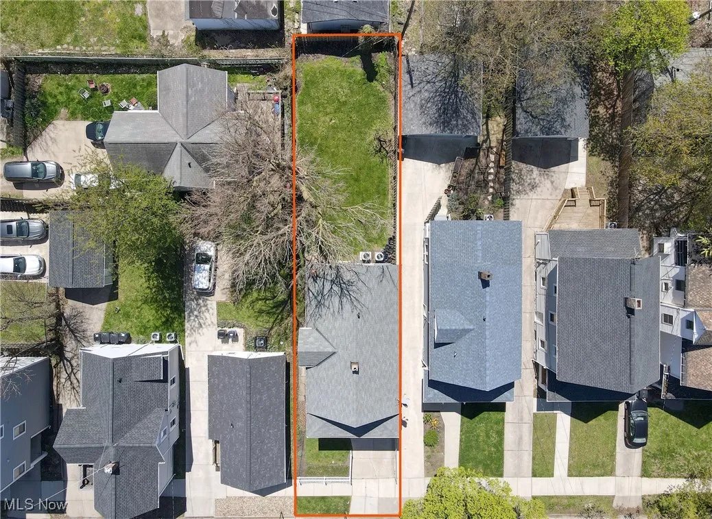 Aerial view of residential area with property parcel outlined