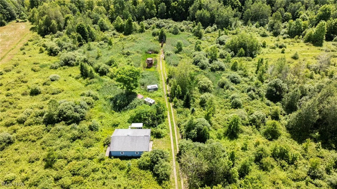 Aerial overview of property's location featuring property parcel outlined