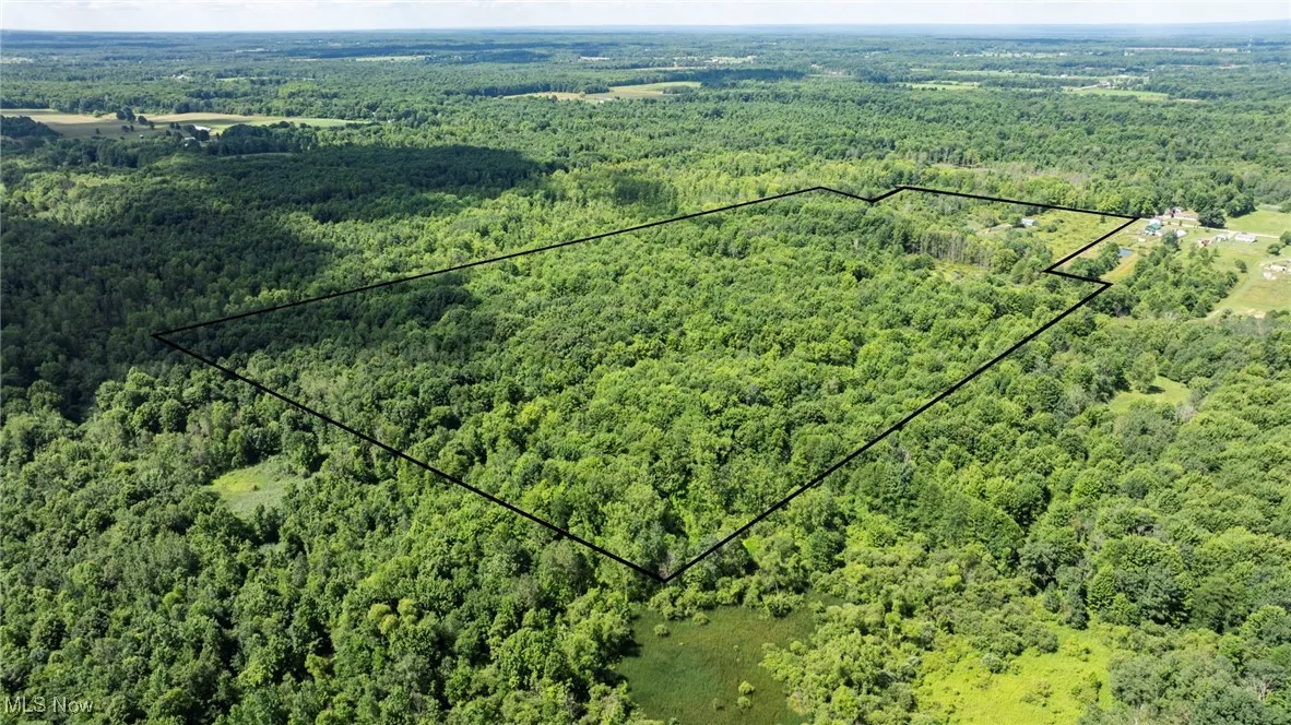 Aerial overview of property's location with property parcel outlined