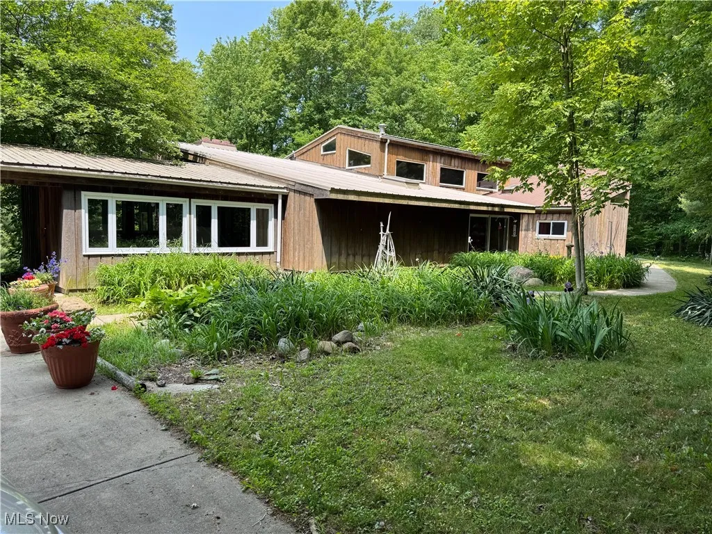 Mid-century inspired home with a front lawn