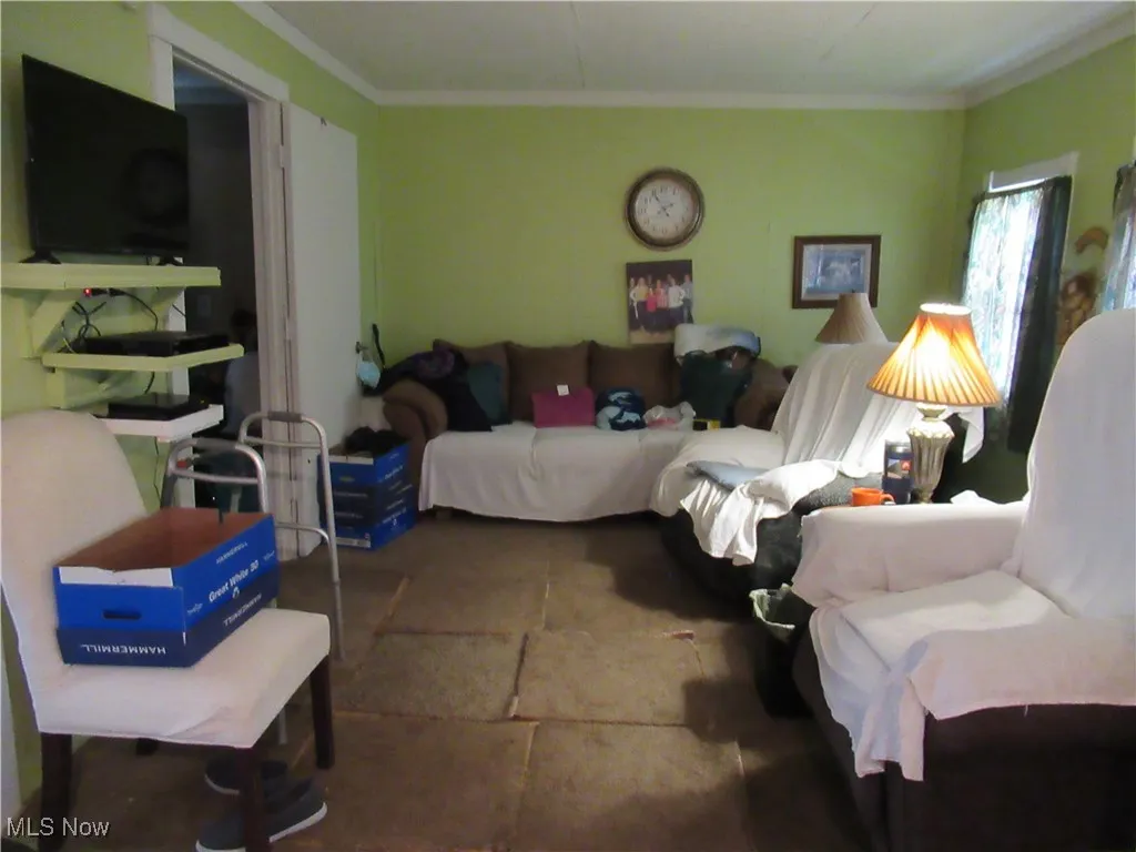 Living room with 2 windows and doorway to Bedroom #1