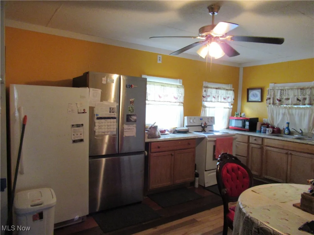 Stove, Stainless Steel Refrigerator and Freezer stay with the home