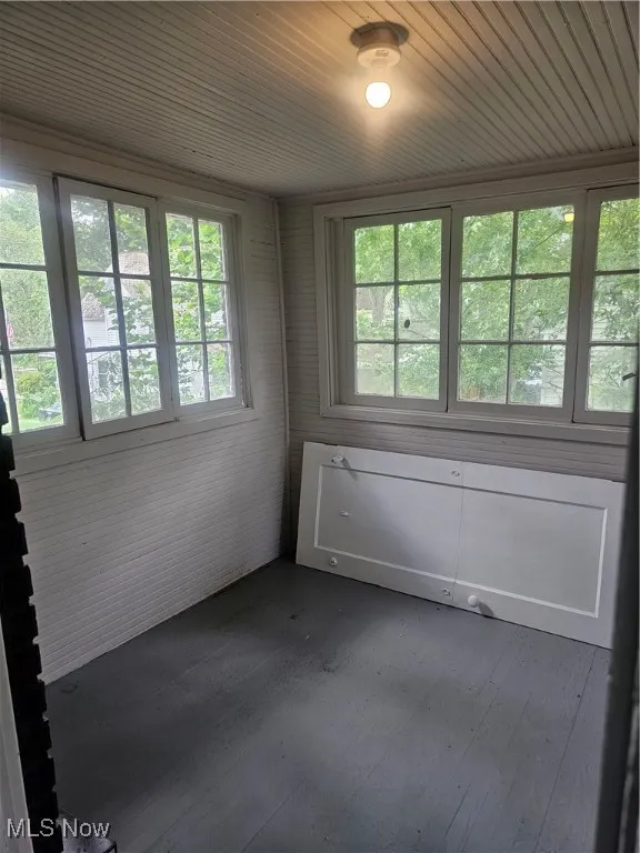 Unfurnished sunroom featuring healthy amount of natural light