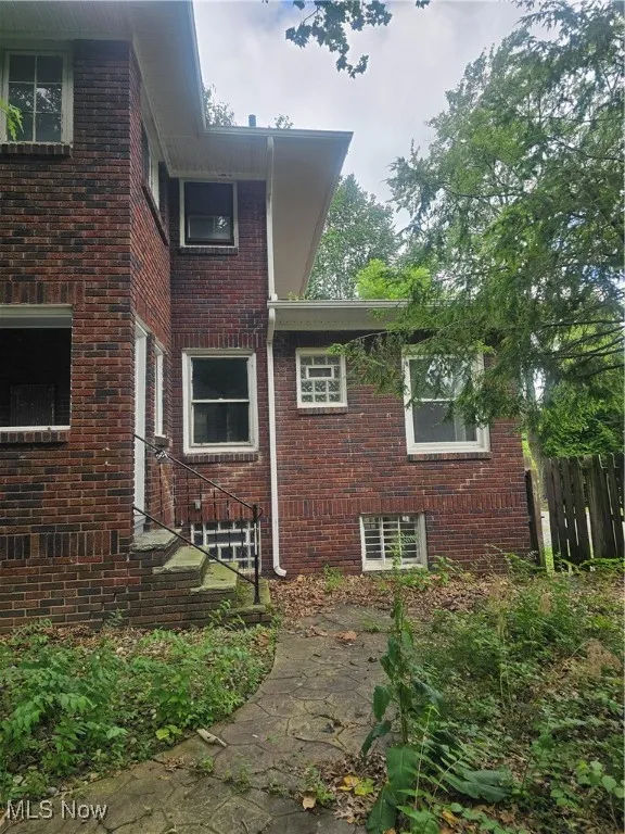 View of side of property with brick siding